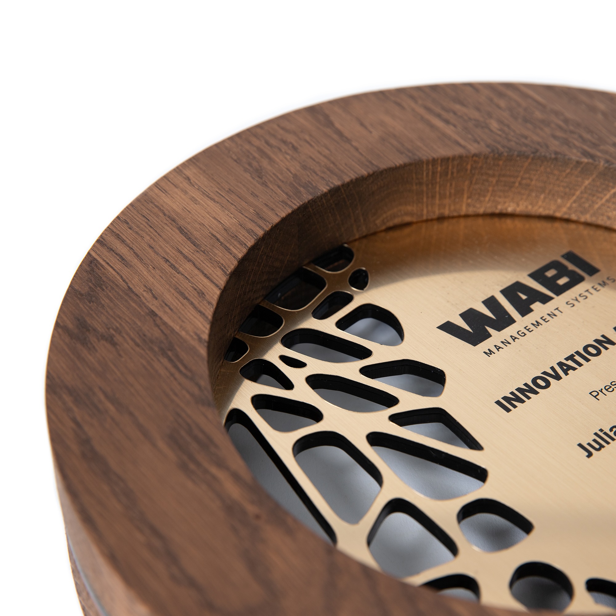 Modern round wooden award with brass plate